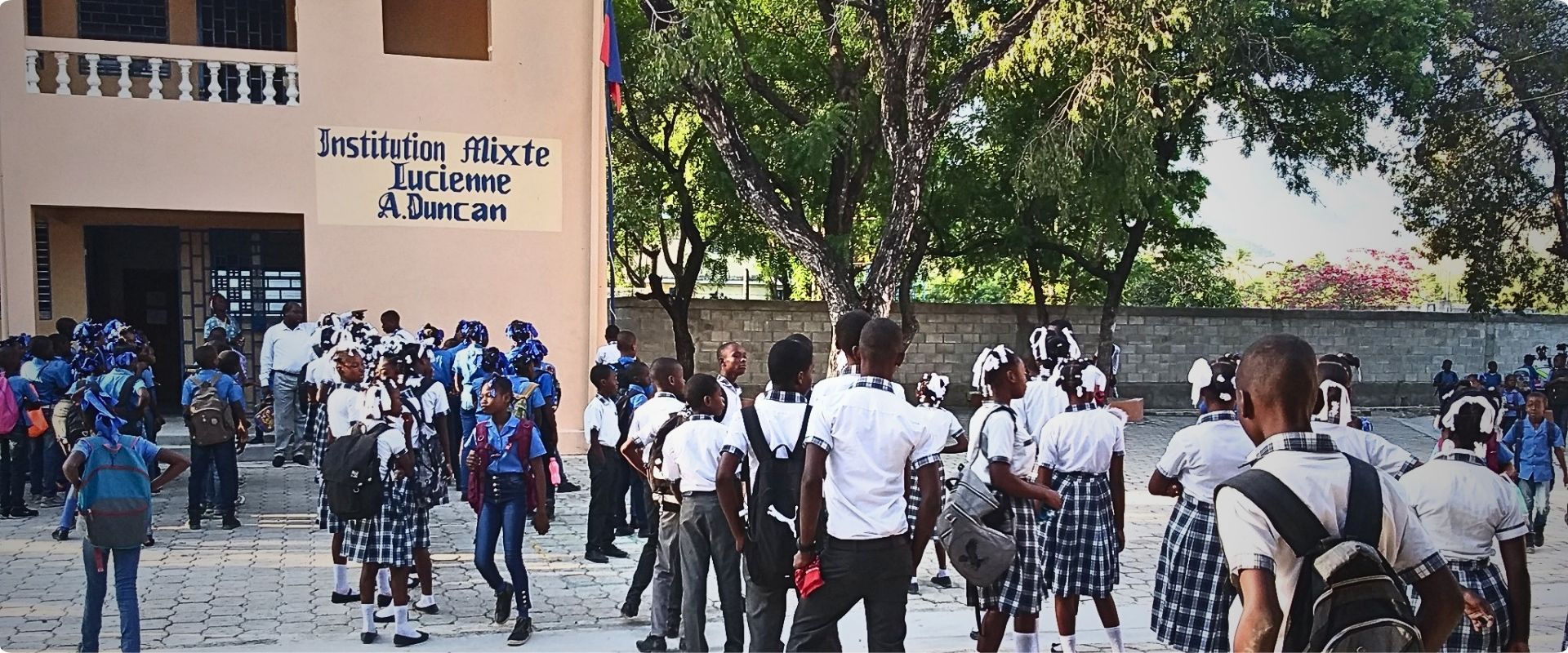 Institution Mixte Lucienne A. Duncan school entrance with trees