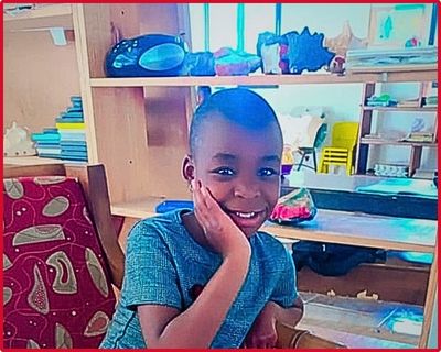 Sabine smiling in her classroom