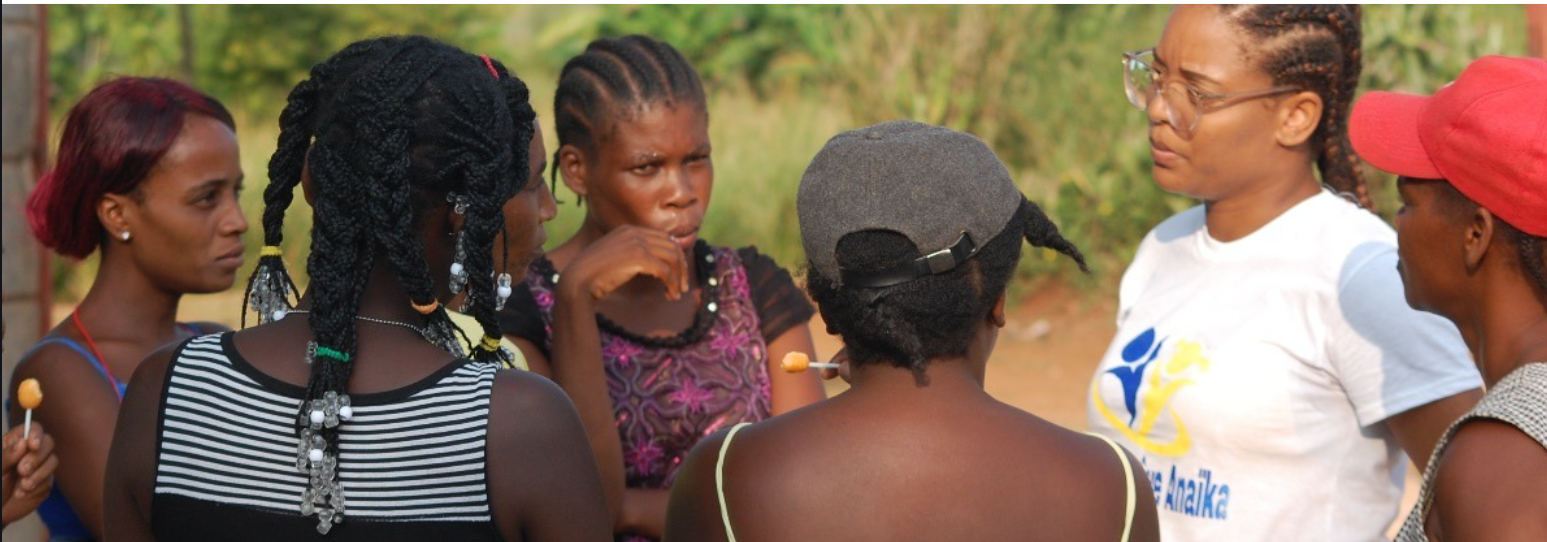 FEJ team members speaking with a group of women and girls in Haiti
