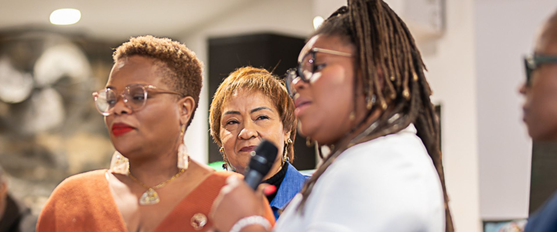Women listening and speaking together at a Seeking Life event